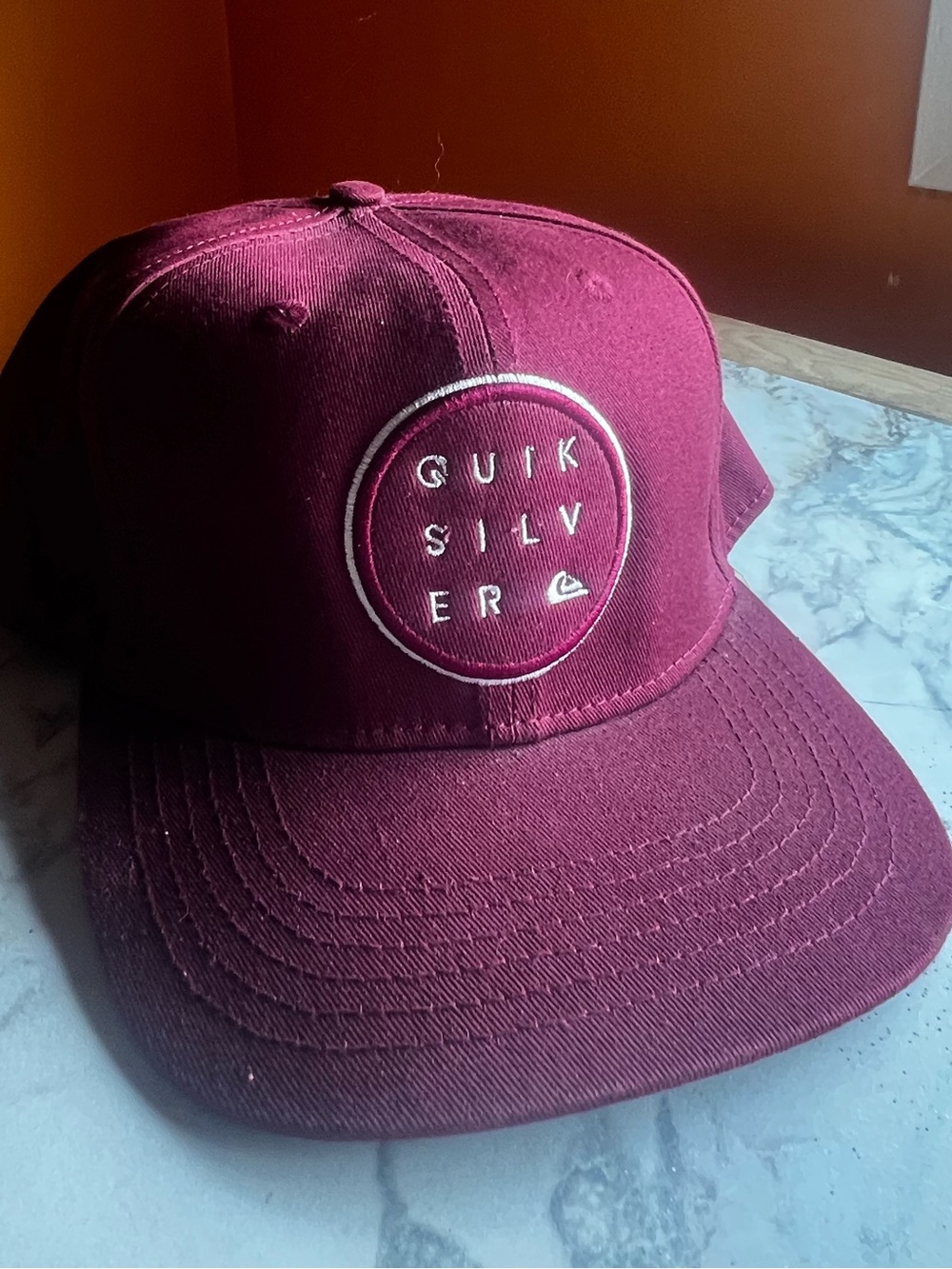 Quicksilver Burgundy Snap Back 
White Logo